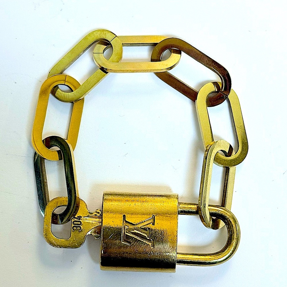 Authentic Louis Vuitton padlock and key bracelet comes complementary